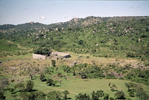 The ruins of Great Zimbabwe. The large circular structure is called the Great Enclosure, which is surrounded by various other ruins in the landscape.