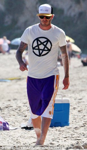 Hero of a nation, trendsetter and idol of millions of boys – David Beckham sports an upside down pentagram, symbol of the descent of man/woman into the abyss. Image source: http://www.dailymail.co.uk/tvshowbiz/article-1377805/David-Beckham-beach-day-boys-Malibu.html