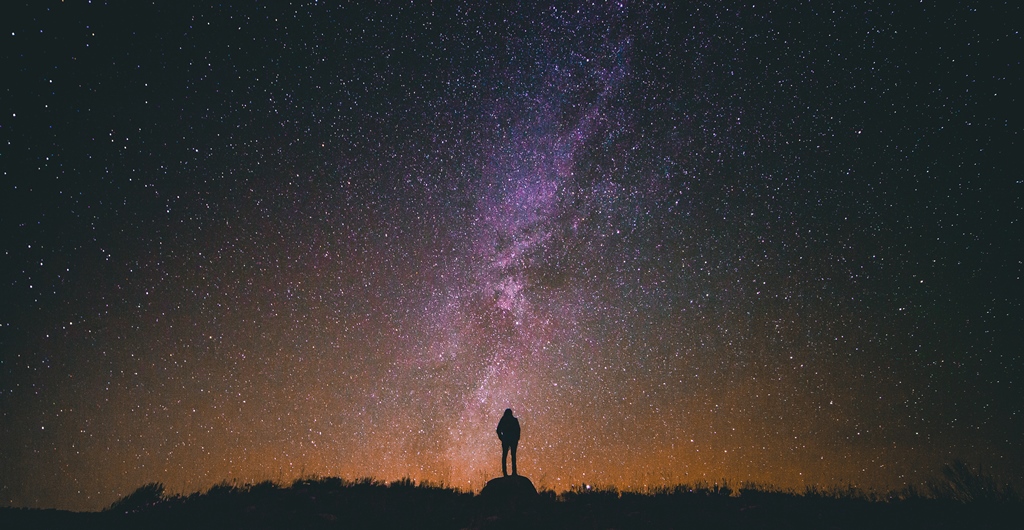 woman-looking-at-stars-galaxy-from-unsplash-by-greg-rakozy_resize
