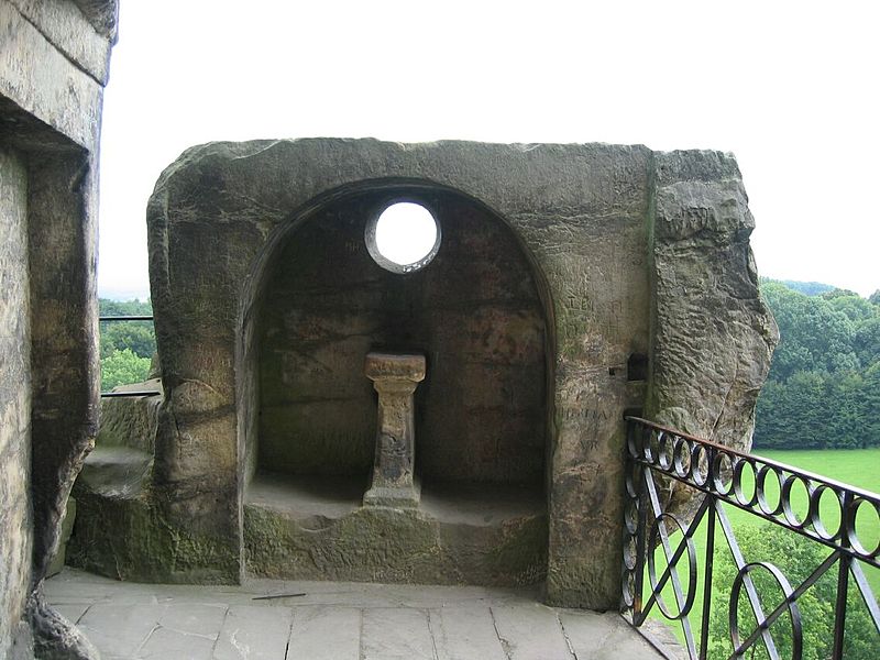 The temple atop of Externsteine near Horn-Bad Meinberg, Germany. The hole in the shrine aligns to the summer solstice sunrise. (photo copyright wiki user R. Engelhardt 6 June 2007)